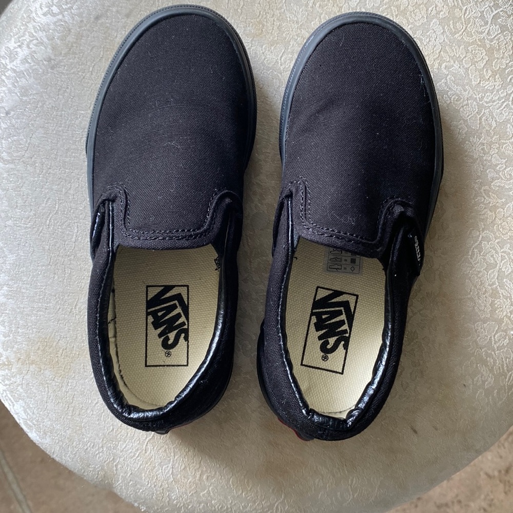 Boys vans slip on s in black with black sole. Size 12 in kids.